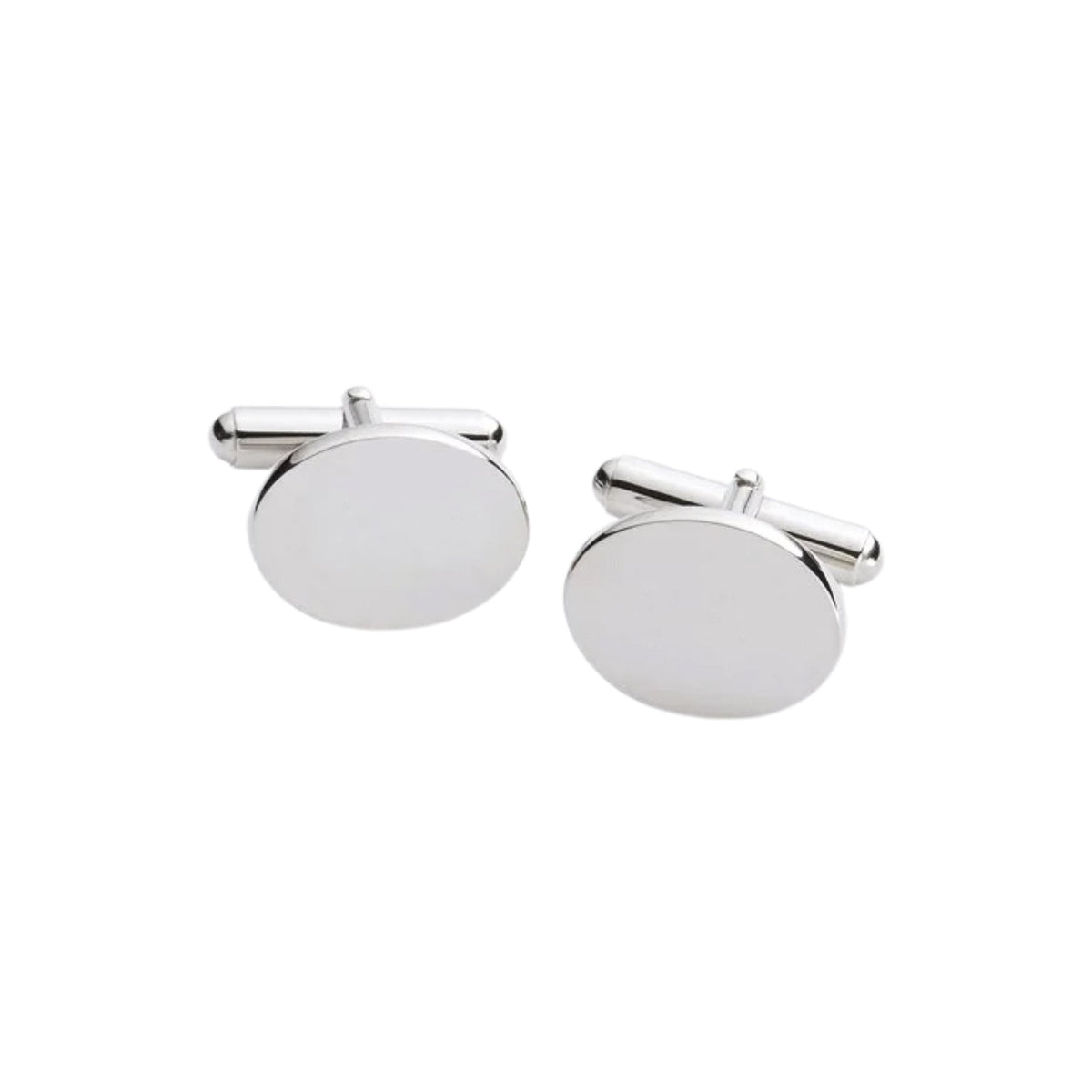 Close-up of elegant oval cuff link with smooth silver finish on white background.