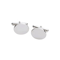 Close-up of elegant oval cuff link with smooth silver finish on white background.