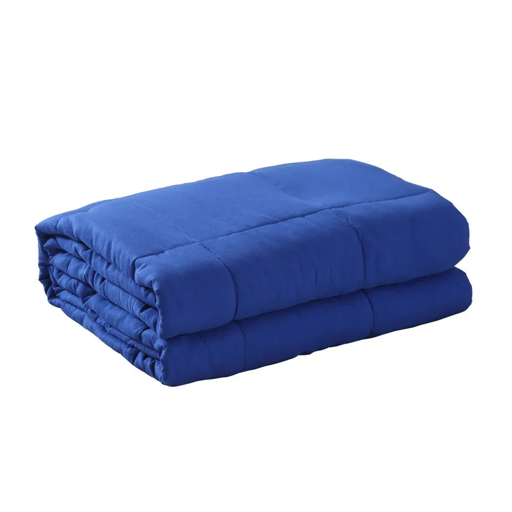 Navy blue DreamZ weighted blanket folded neatly on a white surface.