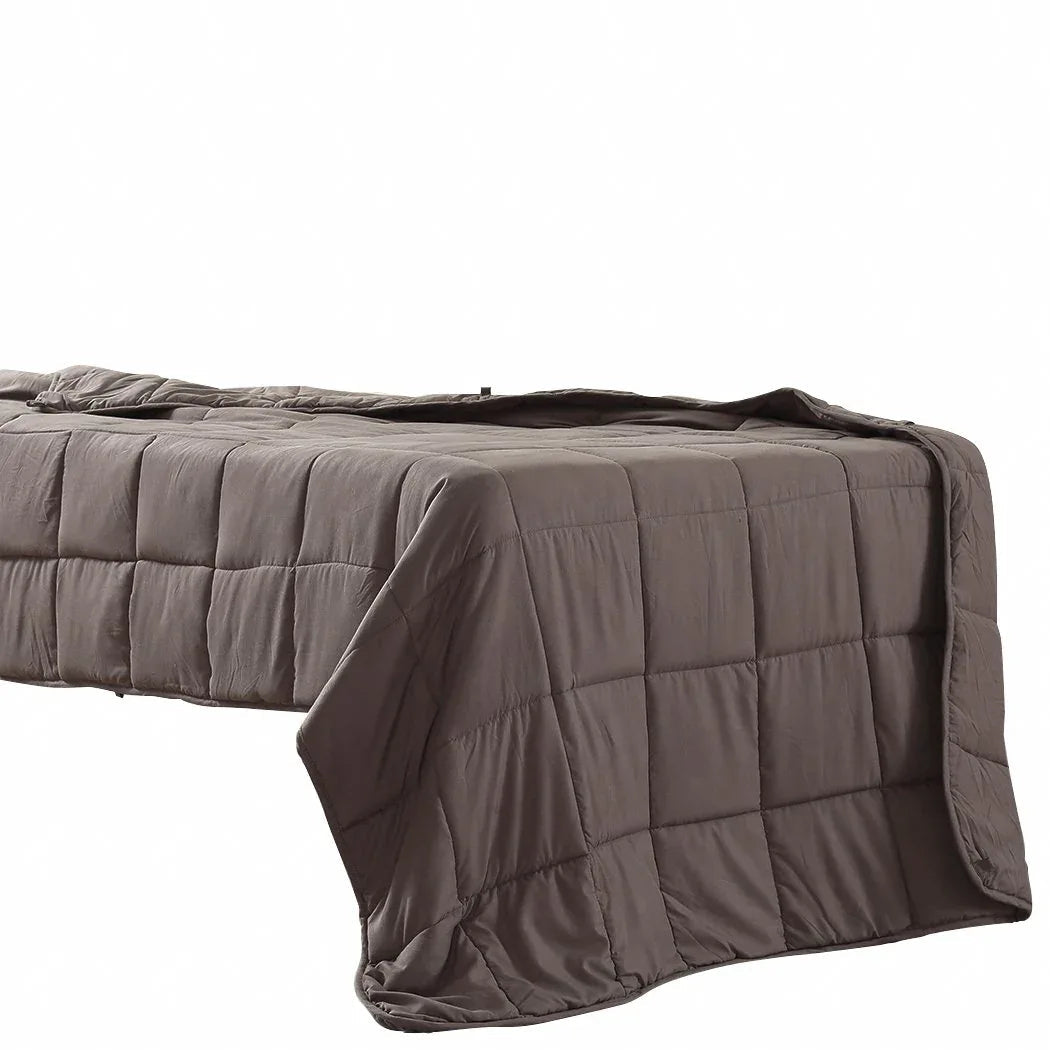 Close-up of quilted weighted blanket fabric highlighting soft polyester mink material.