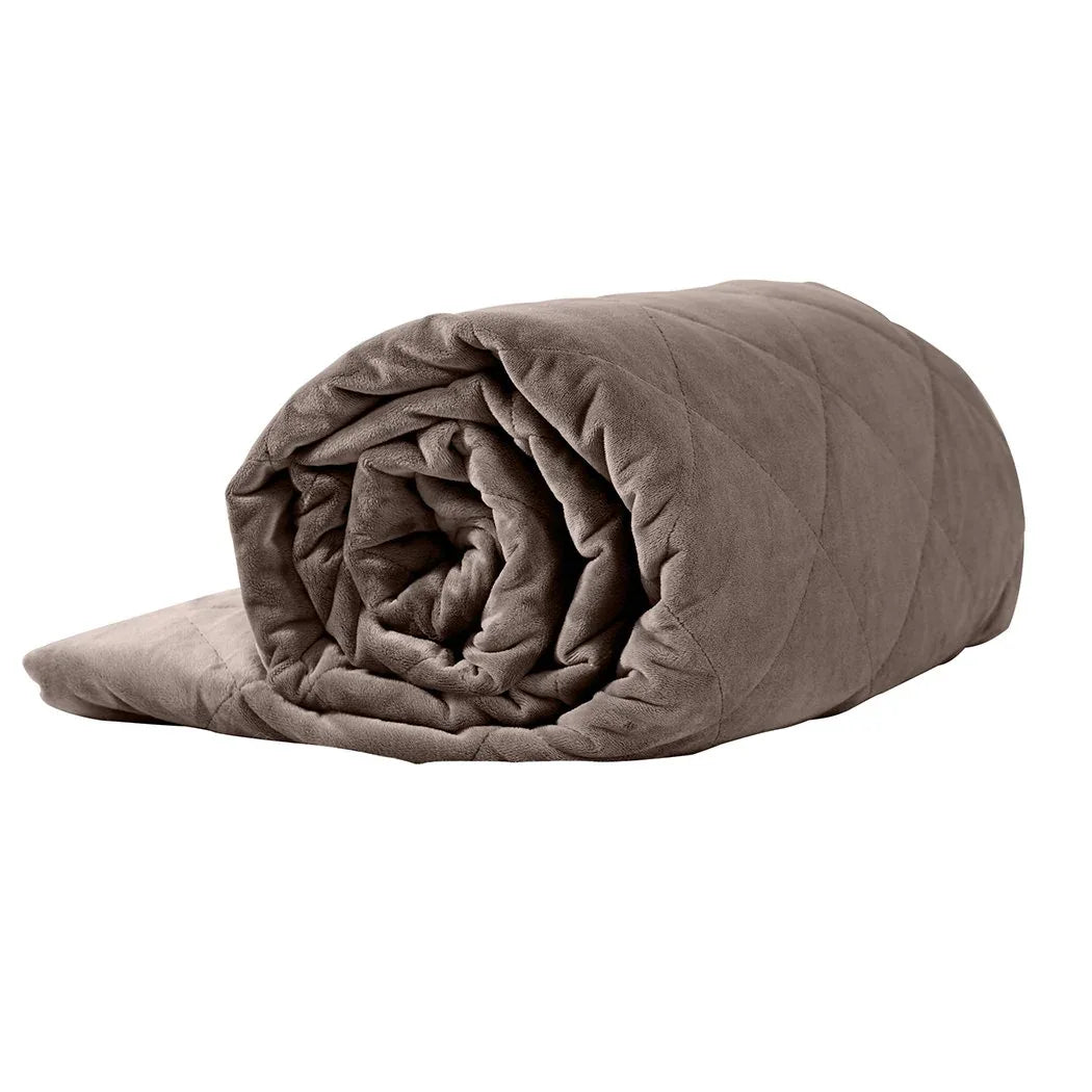 Close-up of textured mink-colored weighted blanket fabric showing softness and quality.
