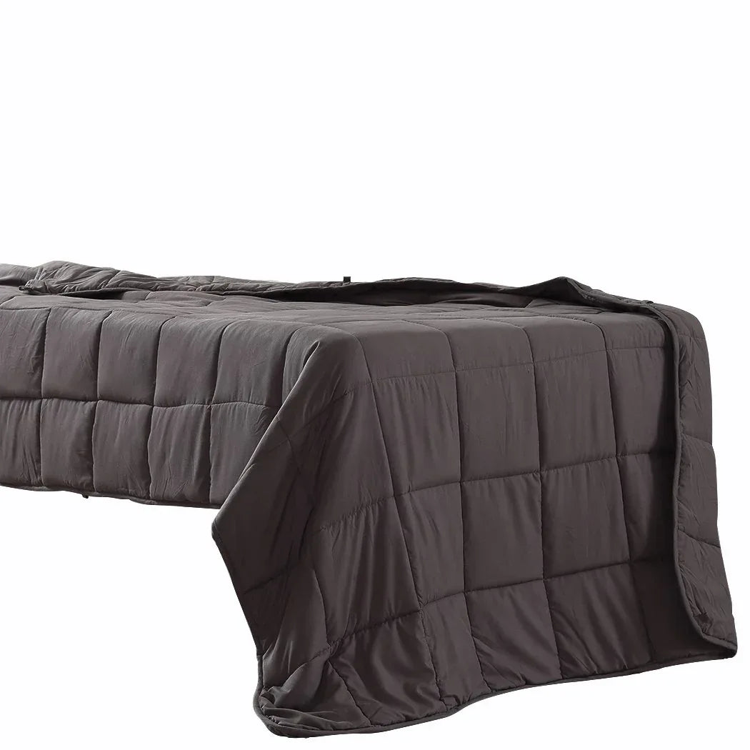 Close-up of weighted blanket's fabric texture revealing breathable, moisture-wicking polyester material.