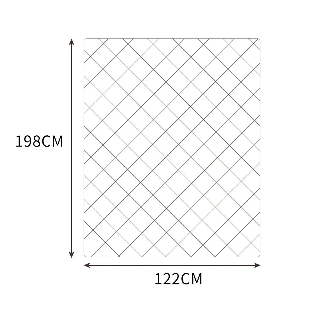 Mink weighted blanket spread out on a white bed highlighting its square stitching pattern.