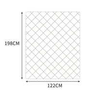 Mink weighted blanket spread out on a white bed highlighting its square stitching pattern.