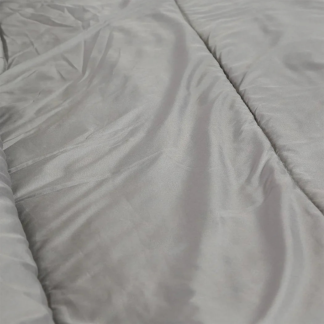 Sleeping bag rolled up and buckled for compact storage with carry handle