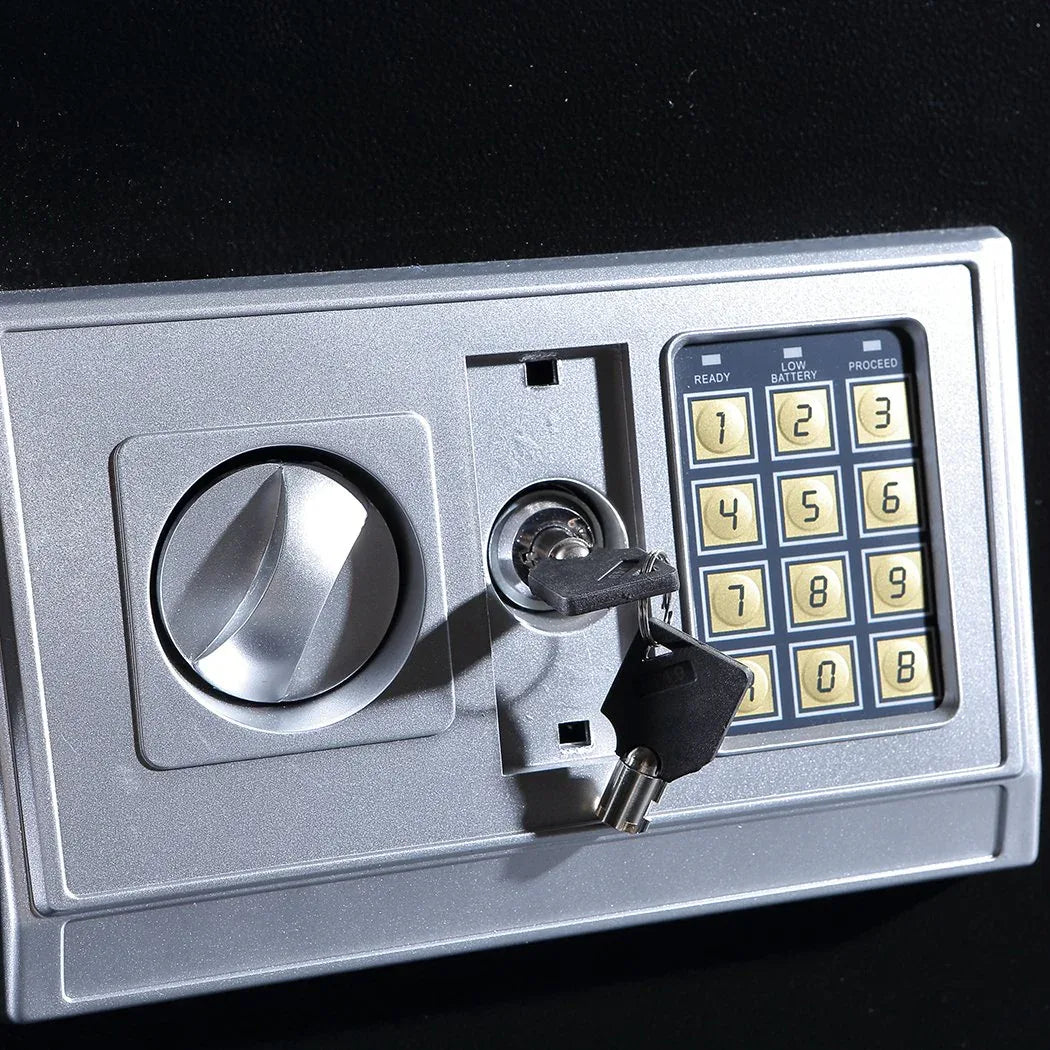 Electronic safe door open, revealing lock bolts and secure steel construction.