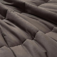 Profile view of DreamZ weighted blanket emphasizing its depth and heavy fill.