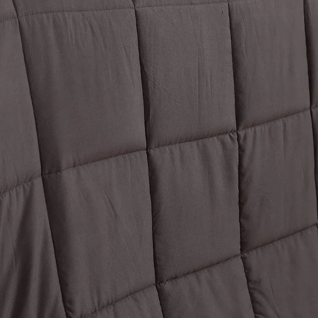 Weighted blanket folded with close-up on stitching and fabric quality details.