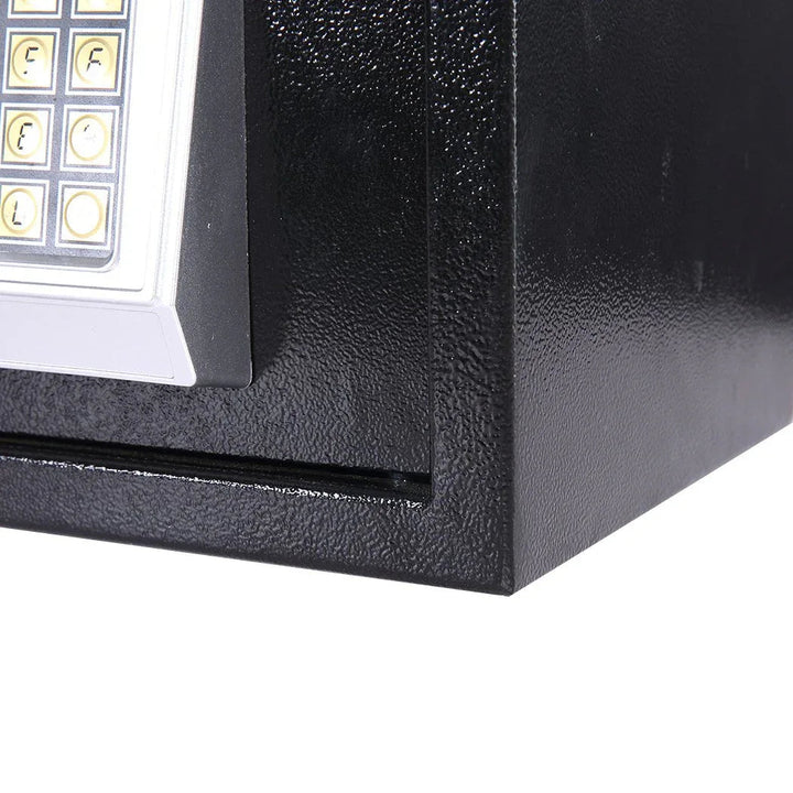 Hand entering code on electronic safe digital keypad for unlocking the safe.