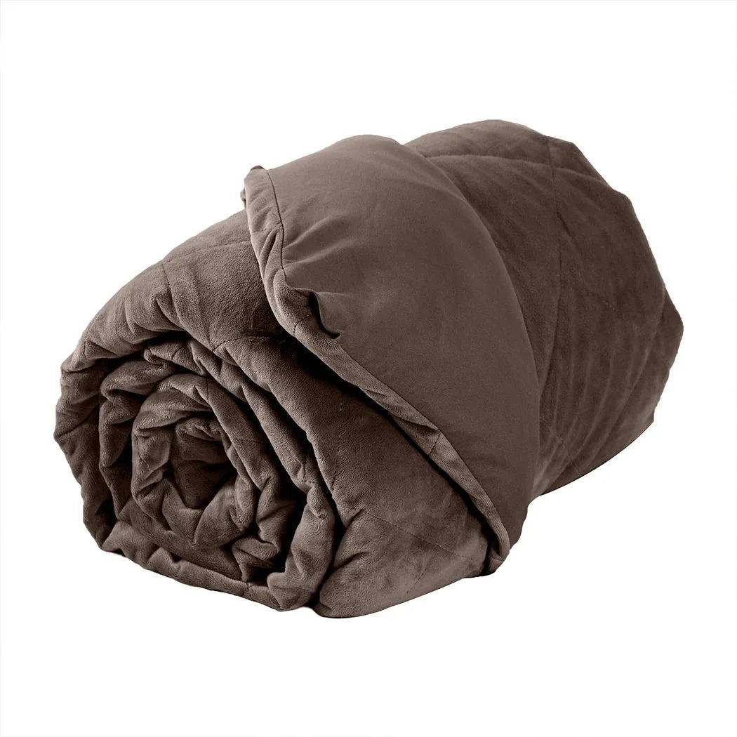 Close-up of hand smoothing over plush mink weighted blanket highlighting breathable cotton fabric.