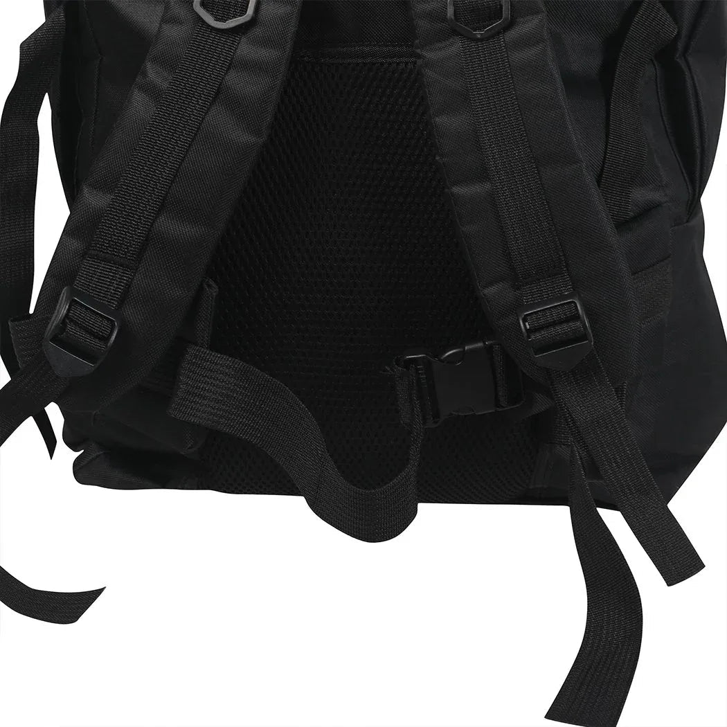 Outdoor view of backpack loaded and worn by person hiking in natural environment.