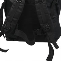 Outdoor view of backpack loaded and worn by person hiking in natural environment.