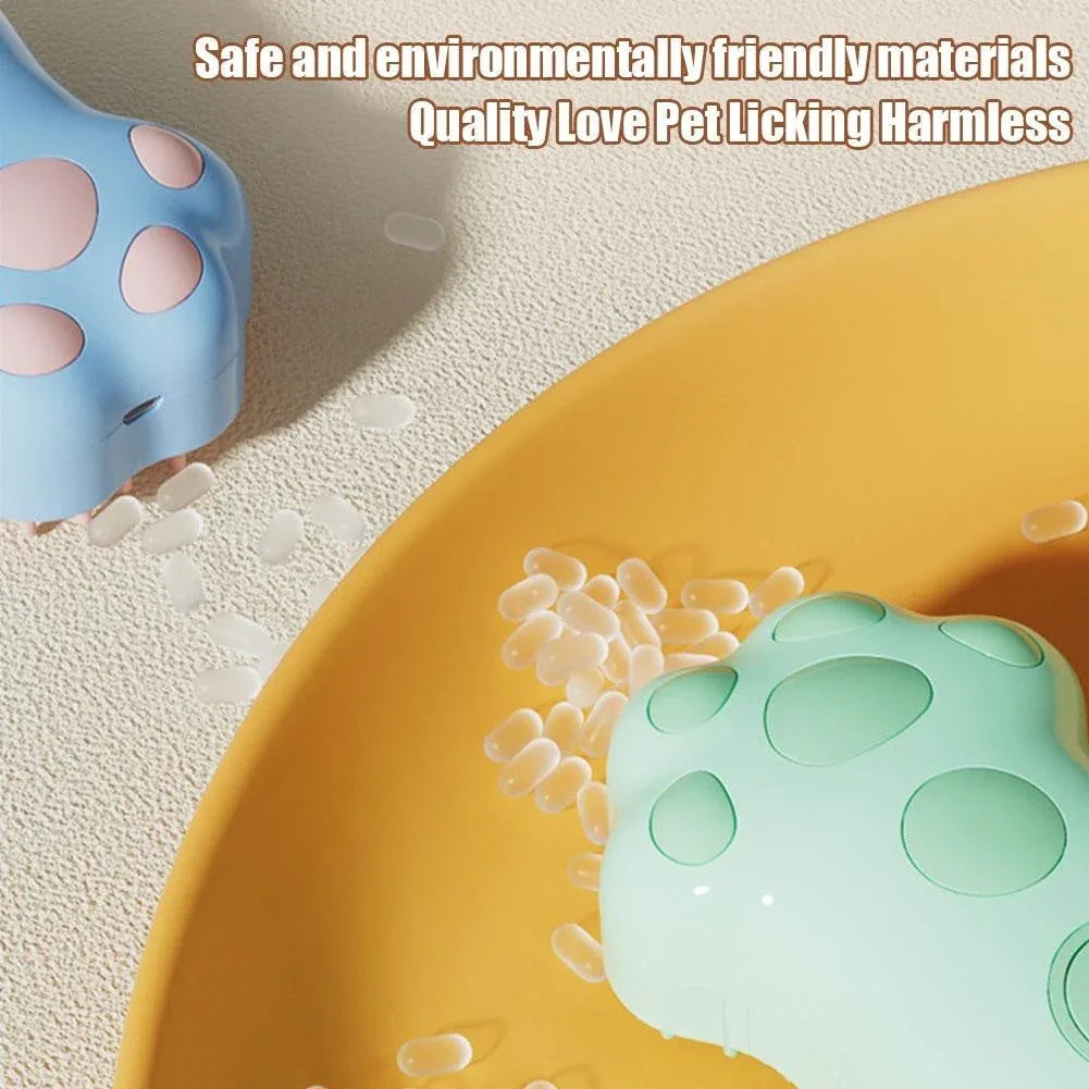 Electric cat and dog spray comb with cat-shaped body and built-in light on dark background.
