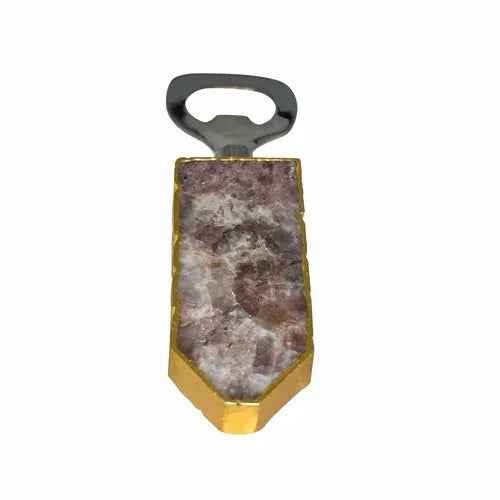 Bottle opener with gold trim and sparkling quartz handle displayed against white backdrop.