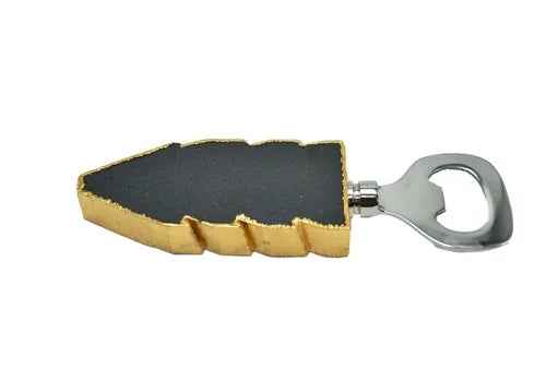 Black quartz handle bottle opener with gold edges shown flat on white background.
