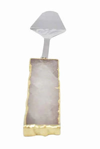 Clear quartz handle cake server with shiny gold trim on knife blade