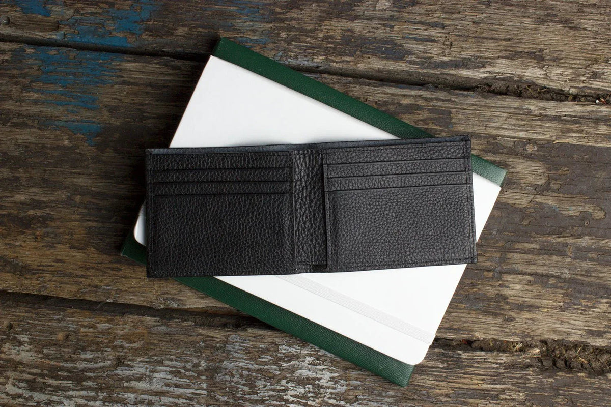 Black pebbled leather wallet from Pink Lucy with visible top grain texture.