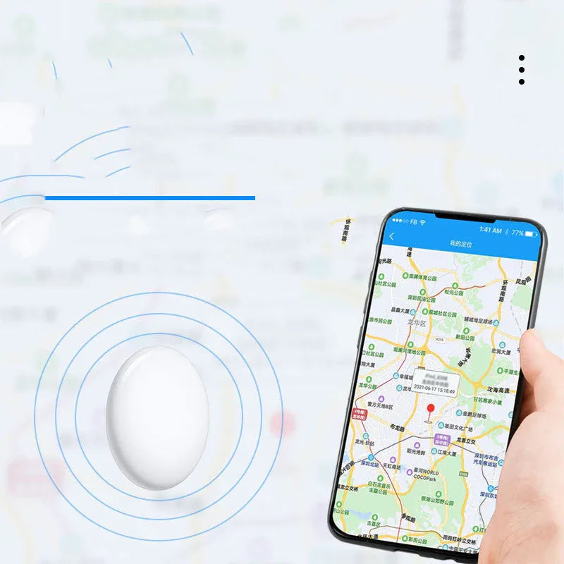 Close-up of the Bluetooth key locator showing the hanging buckle attachment on a white surface.
