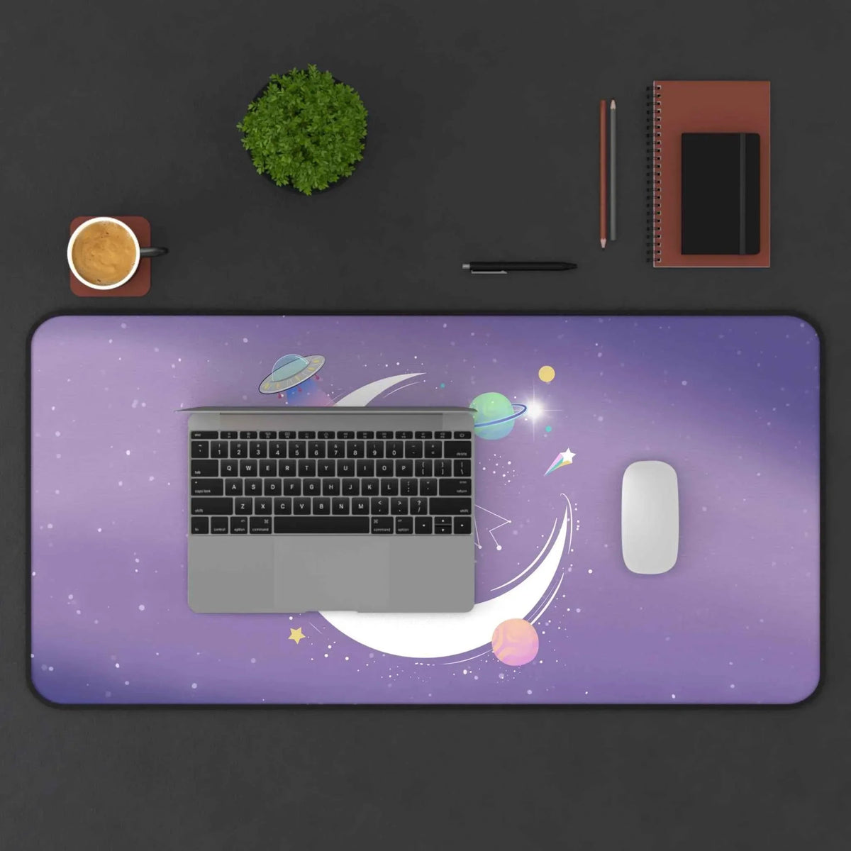 Top view of alien space-themed desk mat showing bright neon colors and cosmic elements