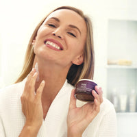 Open jar of creamy Ageless Throat & Decolletage Night Creme with smooth texture