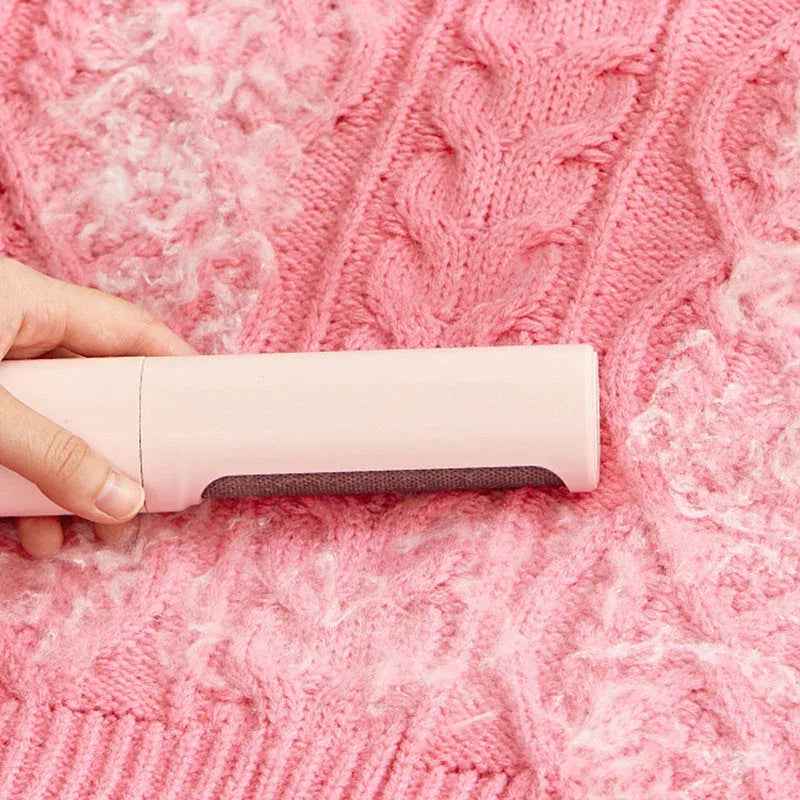 Demonstration of the hair remover brush and lint roller system with dustbin feature.