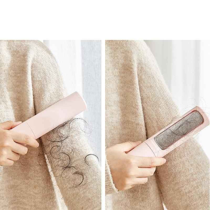 Pet hair remover brush with a handle and roller designed for easy hair collection.