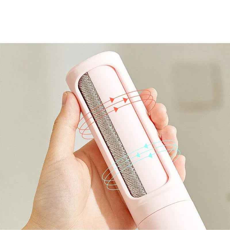 Close-up of the pet hair remover brush with dustbin and button for emptying collected hair.