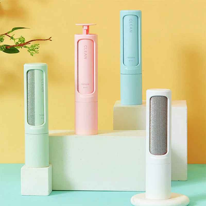 Reusable pet hair remover brush with lint roller and dustbin, shown on a white background.