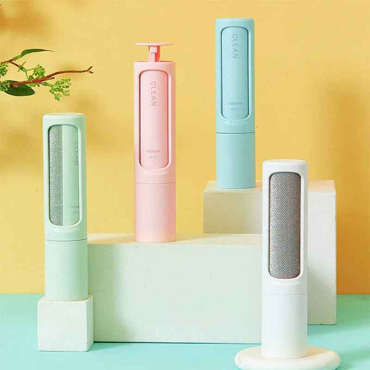Reusable pet hair remover brush with lint roller and dustbin, shown on a white background.