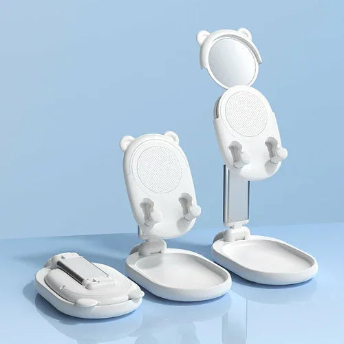 Blue phone holder fully open with mirror angled behind a smartphone.