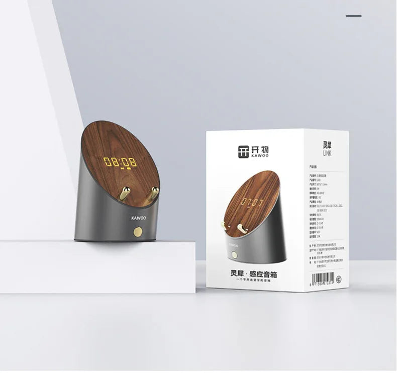 Technical illustration highlighting clock function and induction area of the wooden speaker