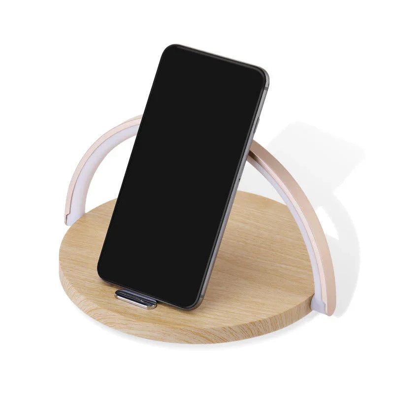 Close-up of wireless charger block holder's charging surface with a glowing USB port.