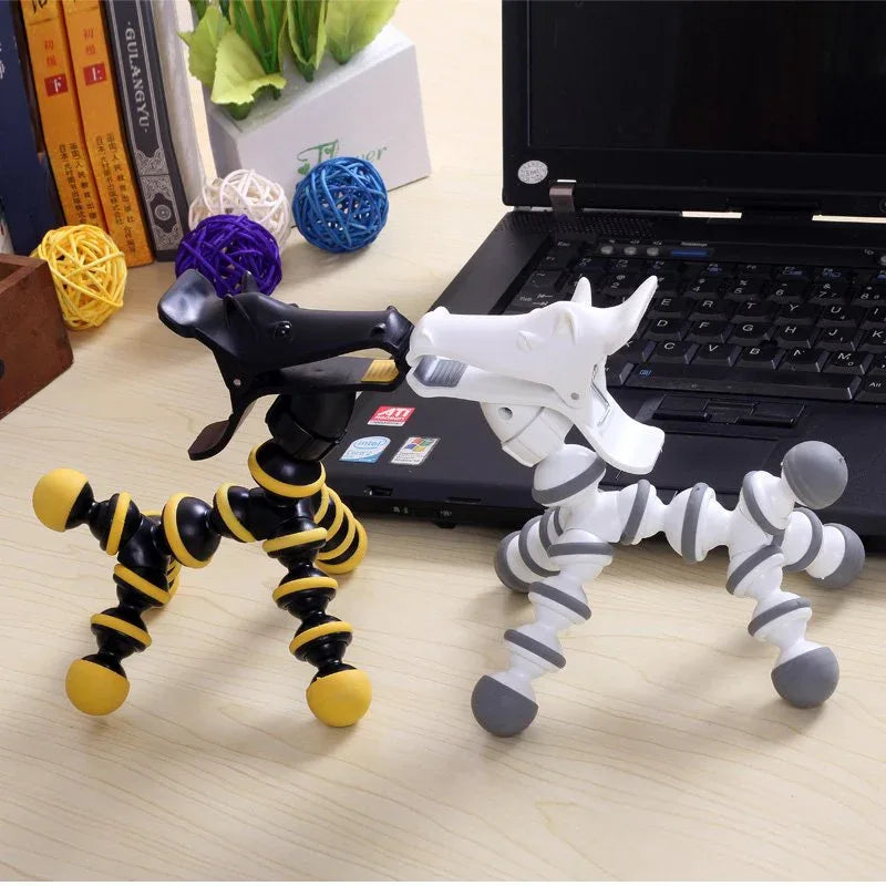 Flexible animal phone stand bending to hold a phone at an angle on a plain white background.