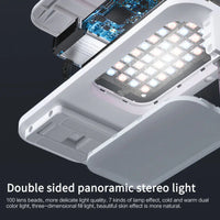 Bluetooth remote control for selfie mobile phone holder shown against dark background.