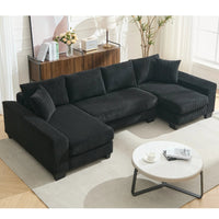 Large black U-shaped corduroy sleeper sofa with plush cushions, square arms, and pull-out bed extended.