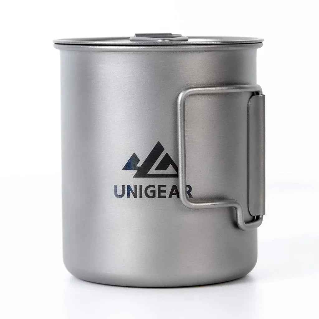 Lightweight titanium camping cup with folding handles, 450ml capacity, shown upright on a plain background.