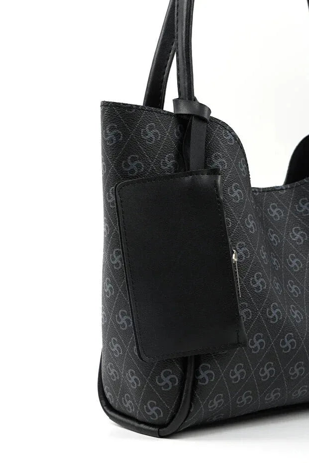 Side view of black faux leather women's bag showing adjustable shoulder strap and zipper closure.