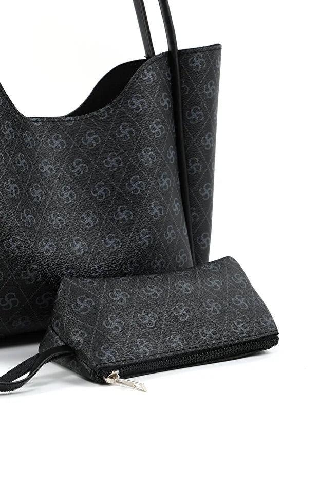 Interior view of spacious black faux leather bag with removable makeup pouch and detachable wallet.