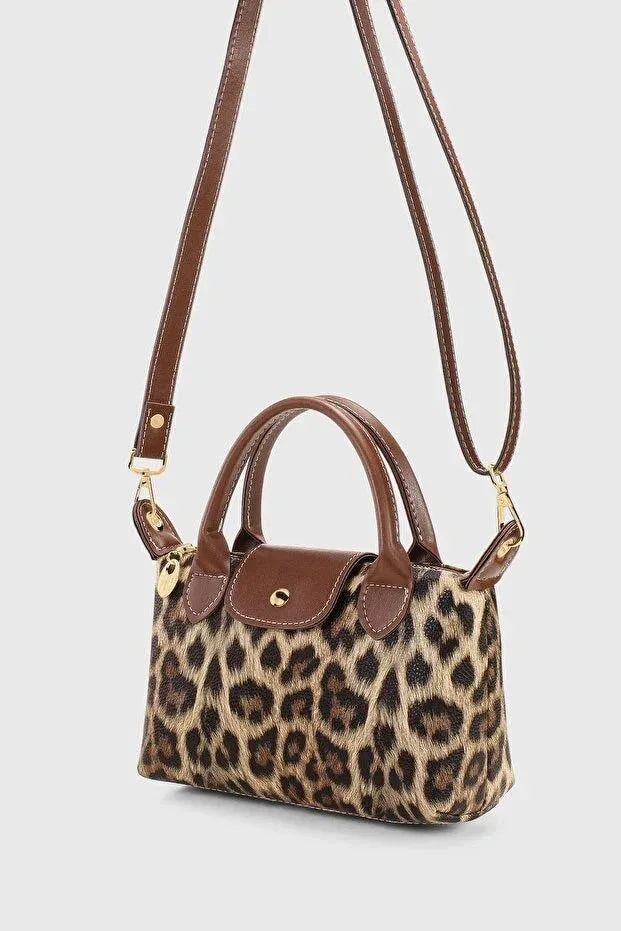 Interior view of crossbody bag showing polyester lining and inner pockets.