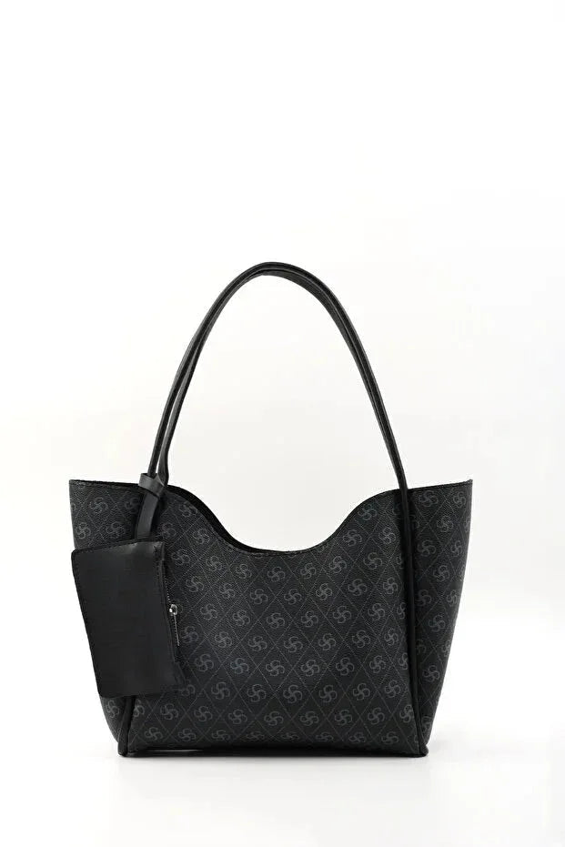 Close-up of detachable wallet and removable makeup bag inside the black faux leather purse.