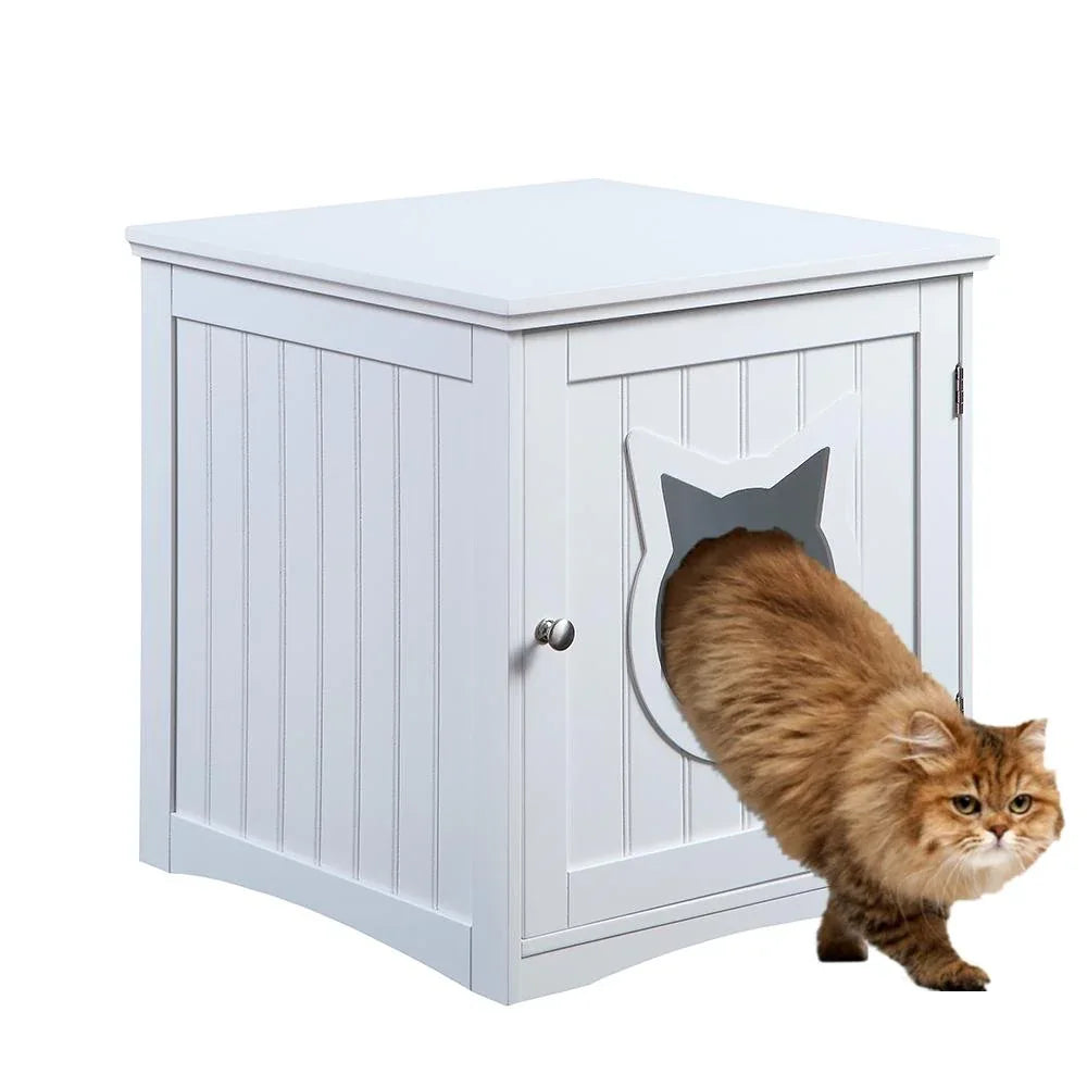 Cat house side table next to armchair with cat door and decorative cat hole