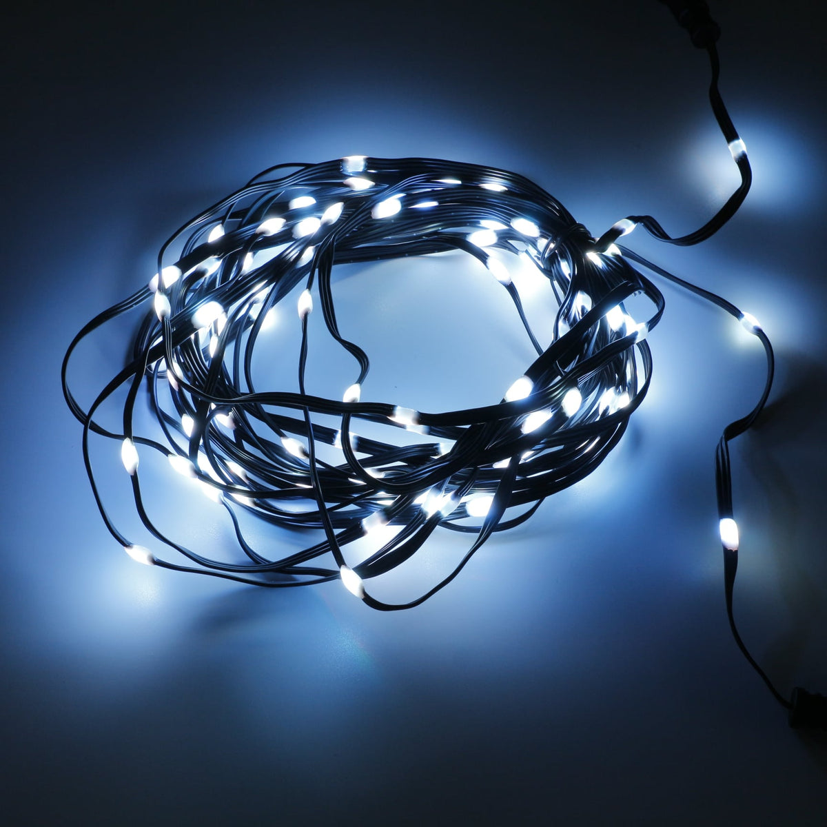 Coiled 12V seed pixel light strand glowing white