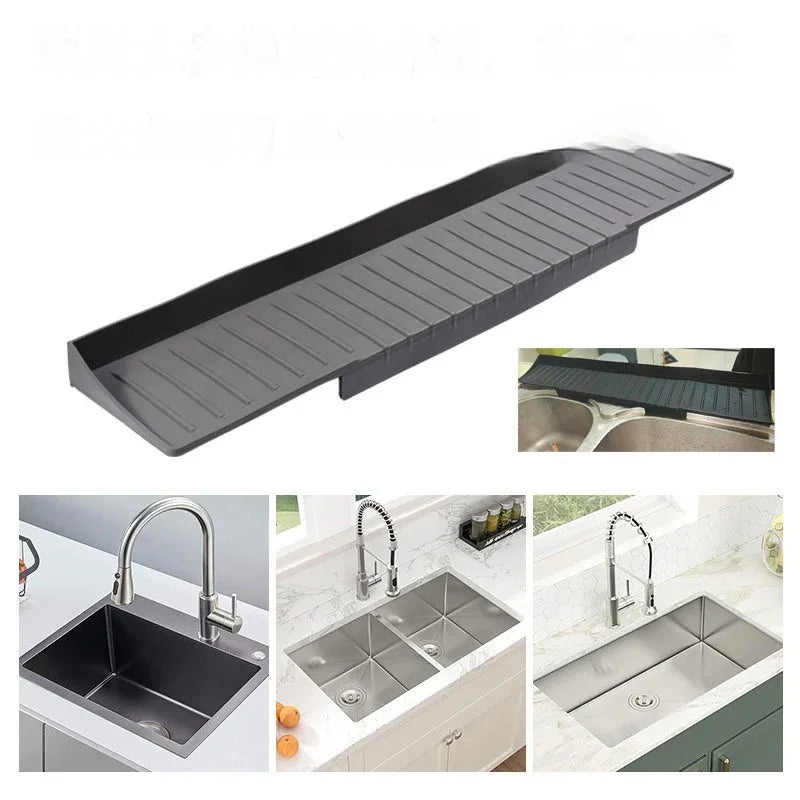 Black silicone sink protective pad with drainage holes displayed on kitchen countertop.