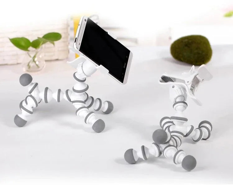 Close-up of flexible animal phone stand gripping a smartphone, showcasing its bendable design.