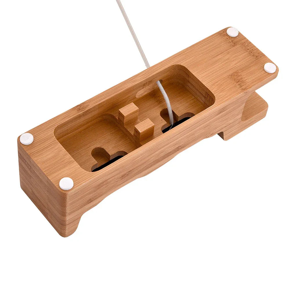 Side view of carbonized bamboo dual phone base holding two mobile phones and a watch stand.