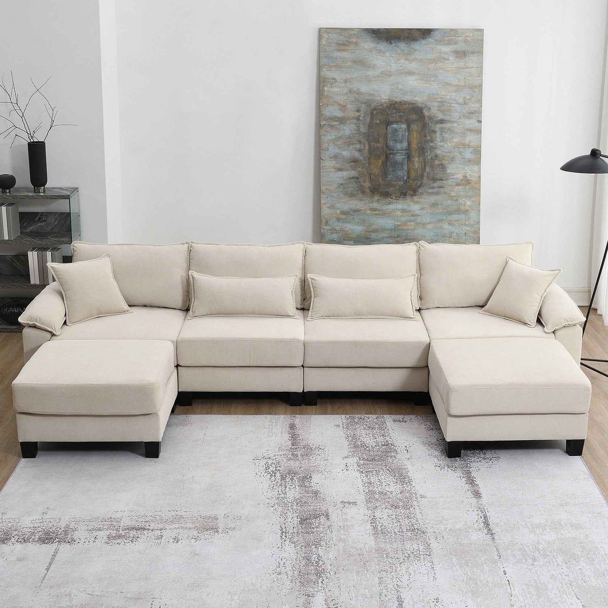 Large beige corduroy U-shaped sectional sofa with armrests, shown in a spacious living room setting.