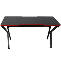 Close-up of gaming desk's carbon fiber textured surface and rounded edges.