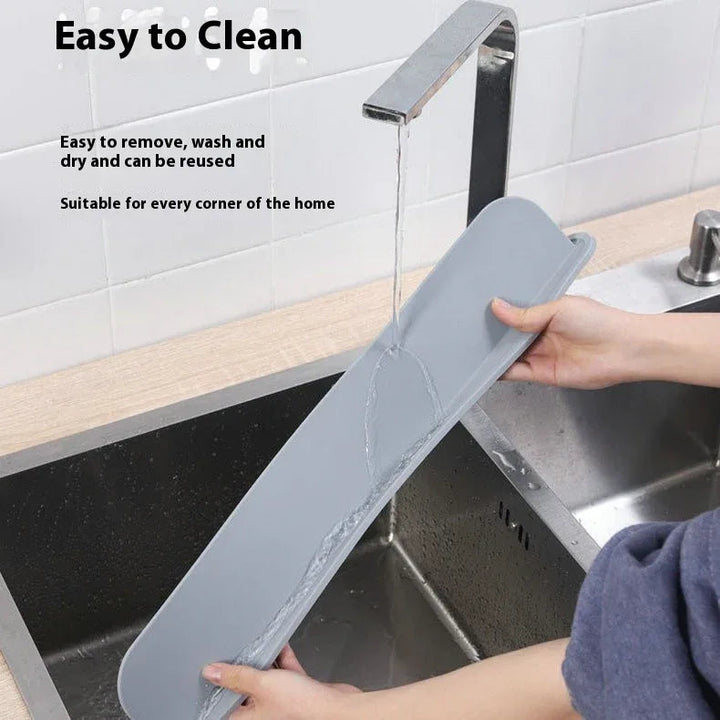 Gray blue thick silicone water blocking plate installed around kitchen sink to prevent water splash.