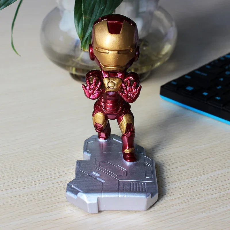 Close-up of Iron Man phone stand chest and arm details with smartphone screen on.