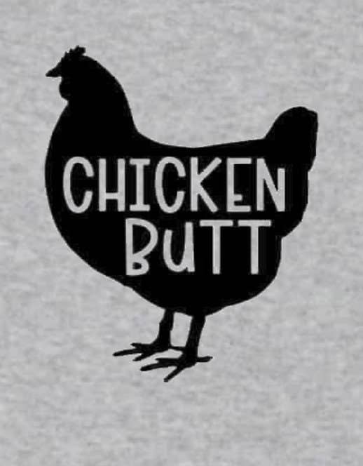 Folded white baby bodysuit displaying 'Guess What!? Chicken Butt' text and chicken graphic.